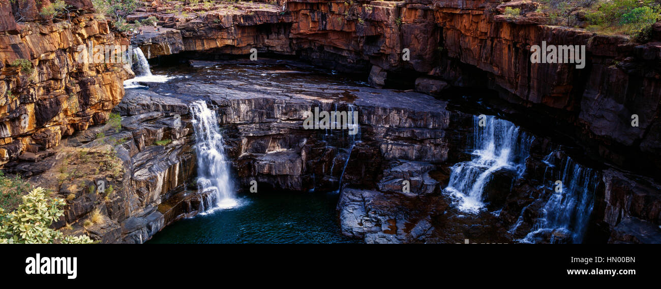 The magnificent Mitchell River cascades down ochre sandstone tiers in multiple waterfalls. Stock Photo