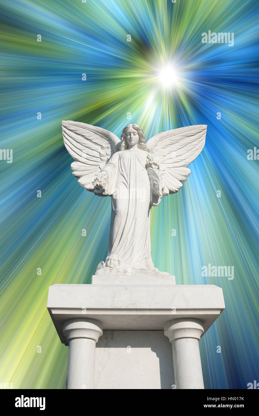 White angel statue with blue and white rays, symbol image for celestial, purity, hope Stock Photo