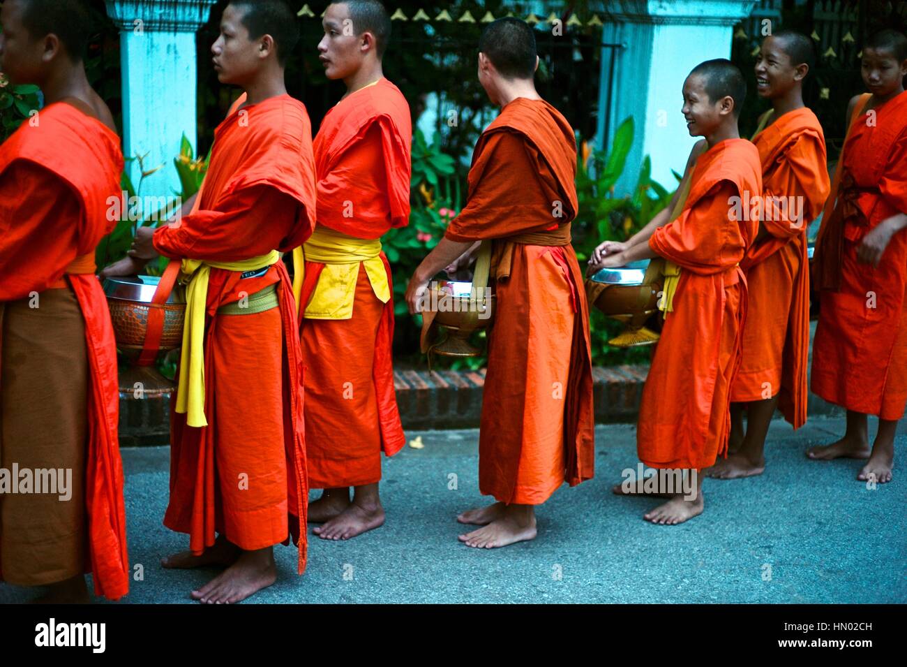 Early morning alms giving to the monks in Luang Prabang (Laos), known as Binthabhat. Stock Photo