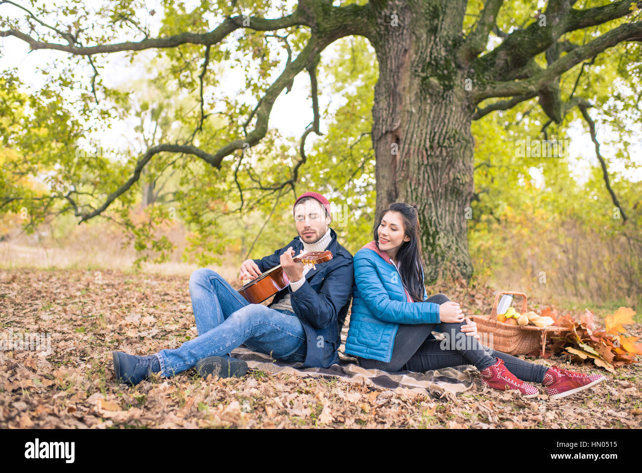 Romantic couple in autumn forest Stock Photo - Alamy