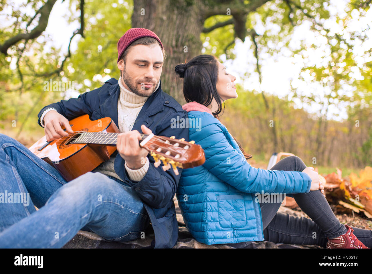 Romantic couple in autumn forest Stock Photo - Alamy