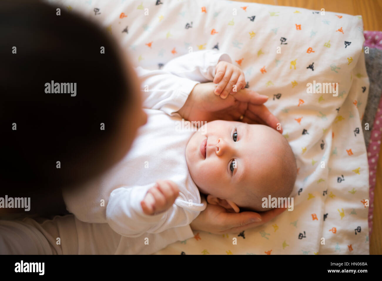 Unrecognizable mother caressing her cute baby son Stock Photo
