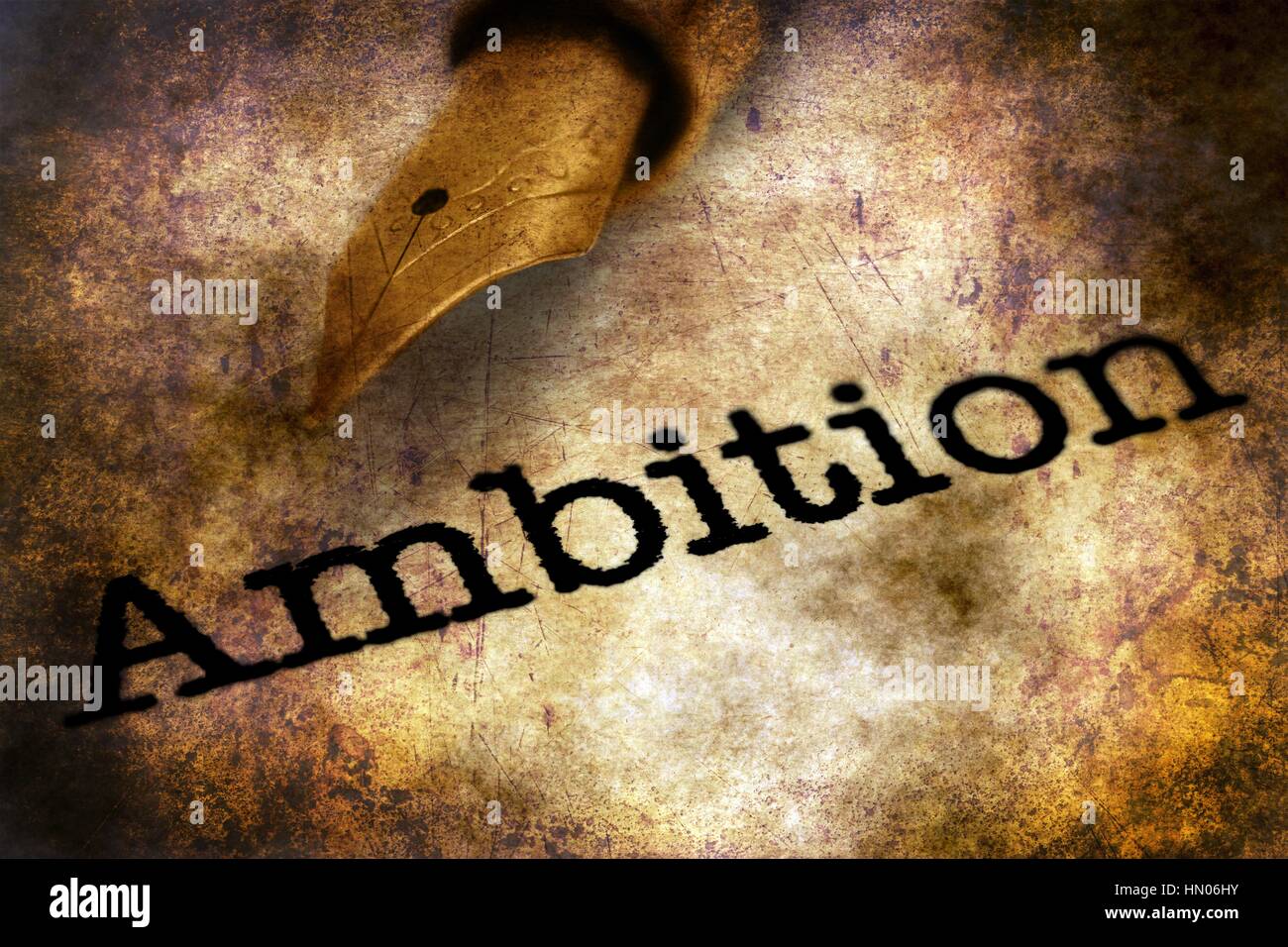 Fountain pen on ambition text grunge concept Stock Photo - Alamy