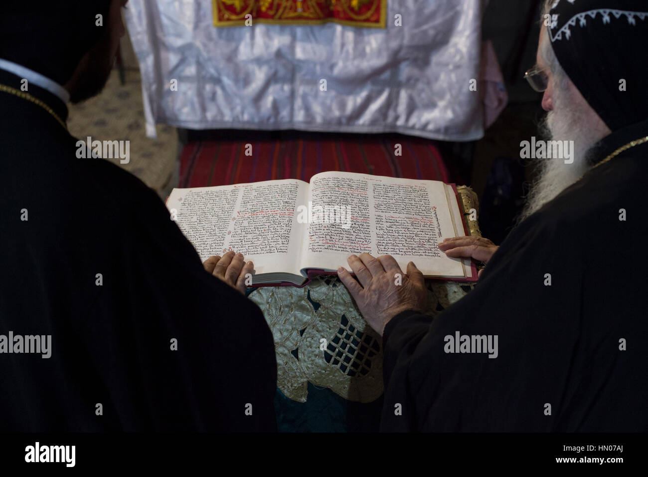 Jerusalem, Israel - November 17, 2013: Syrian Orthodox priests hold Sunday mass in the Syrian Chapel next to Saint Joseph of Eritrea tomb in the Churc Stock Photo