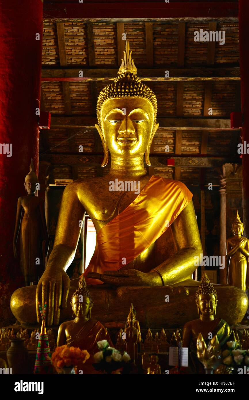 Golden statue of Buddha at a temple in Luang Prabang Stock Photo - Alamy