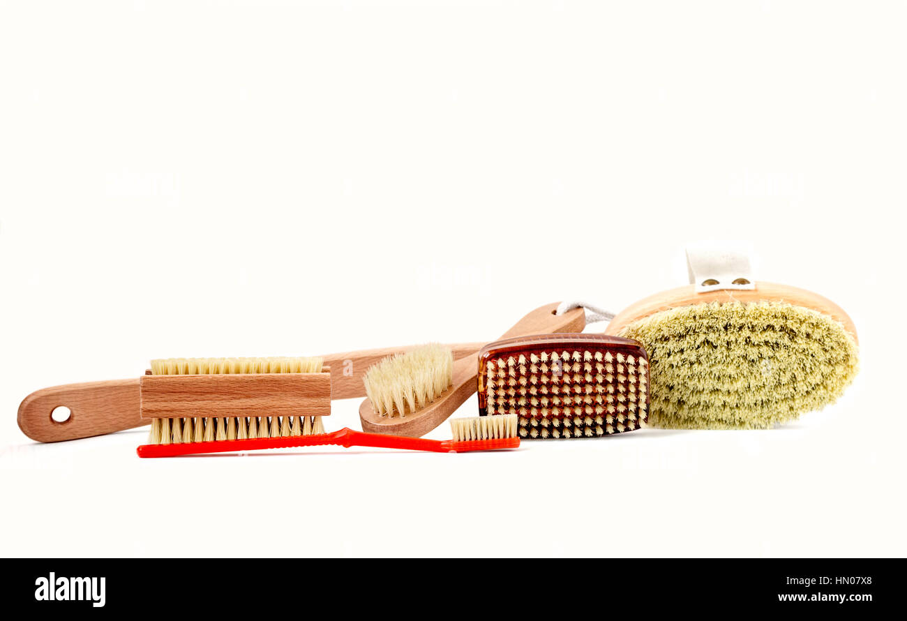 Assortment of wood and plastic brushes with natural bristles isolated on white Stock Photo