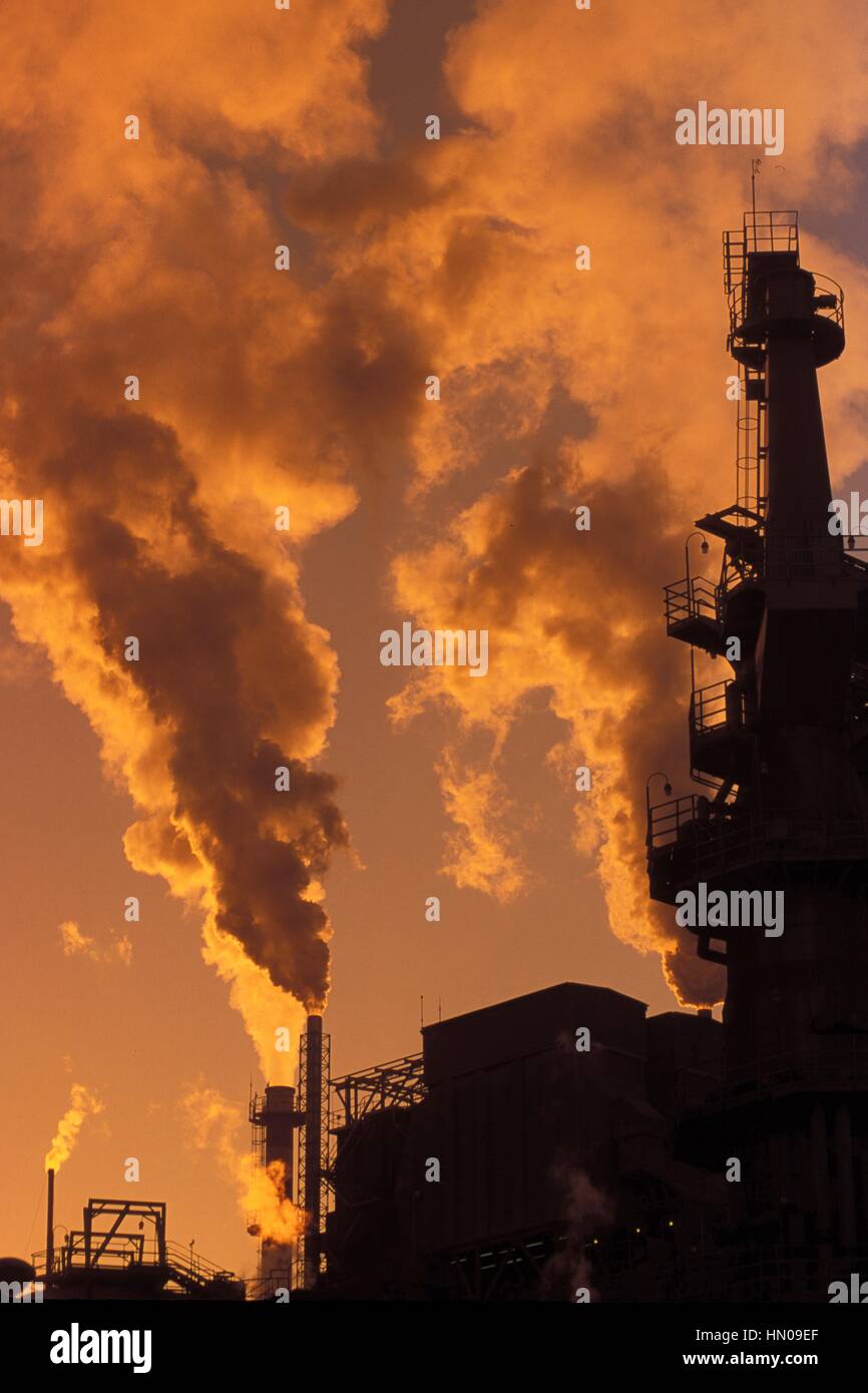 Paper factory blowing smoke and pollution into the air Stock Photo - Alamy