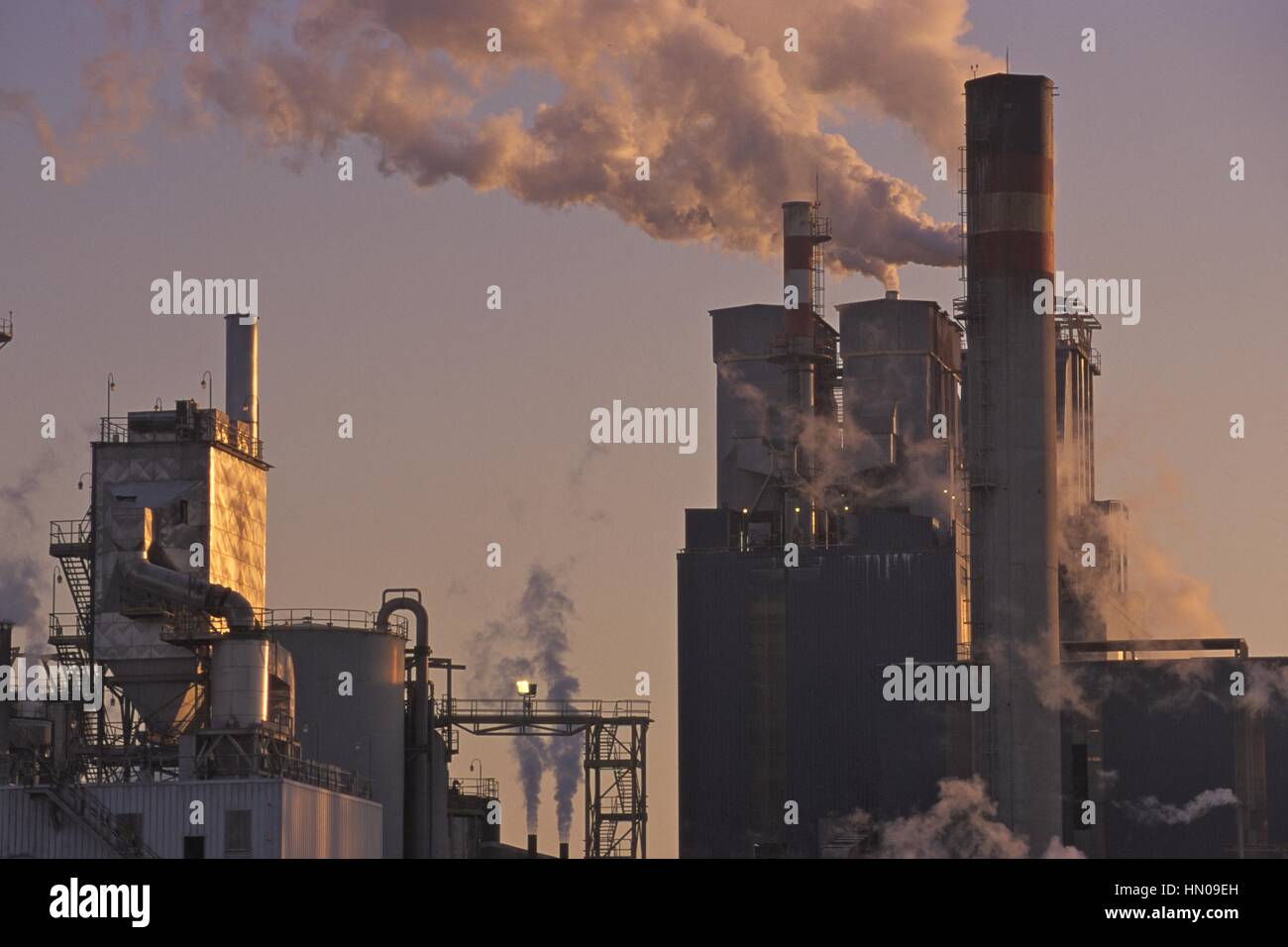 Paper factory blowing smoke and pollution into the air Stock Photo - Alamy
