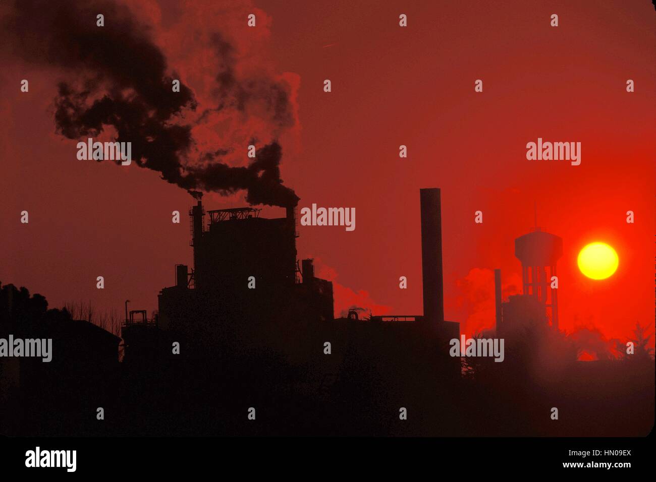Paper factory blowing smoke and pollution into the air Stock Photo - Alamy