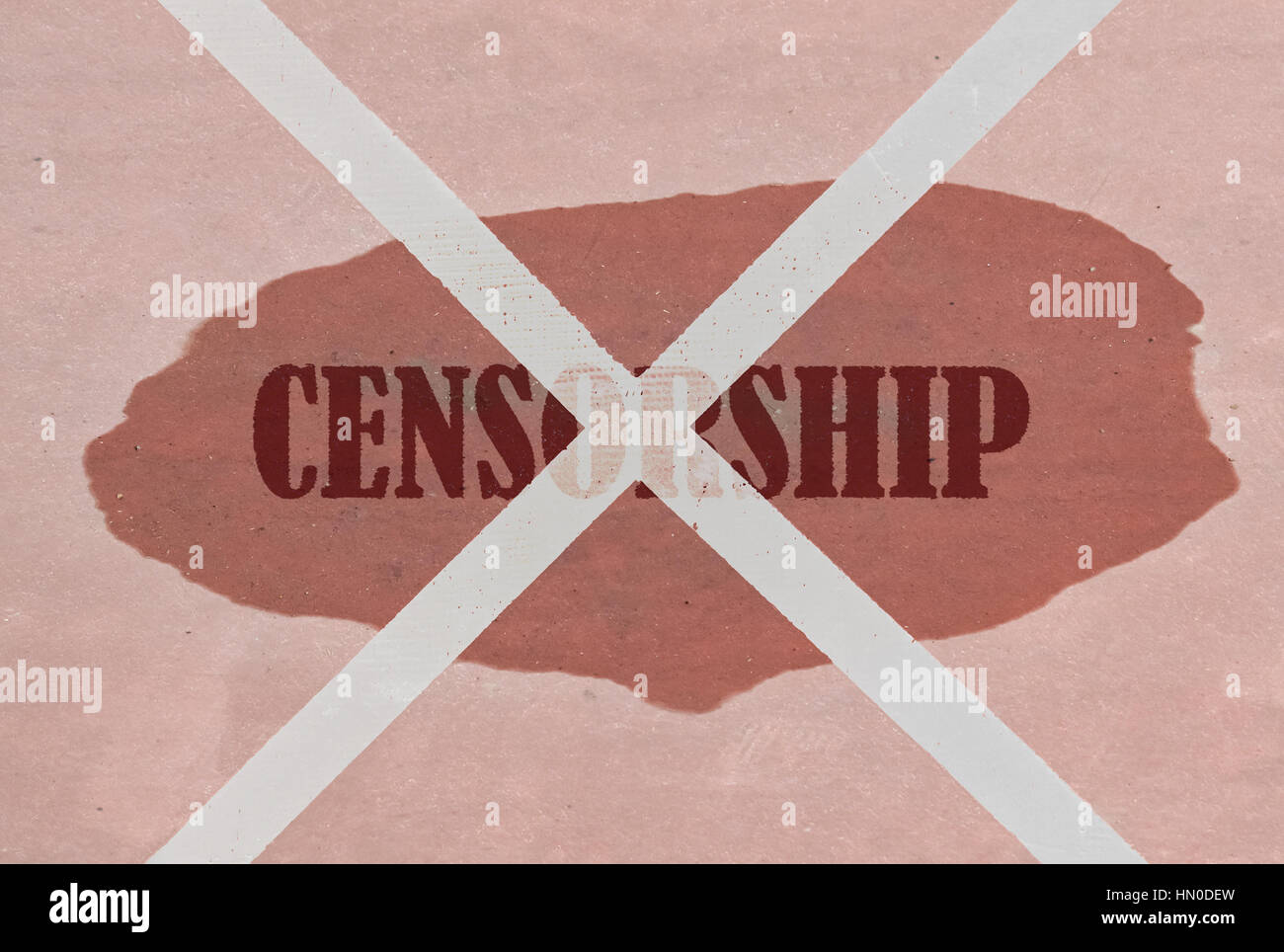 Strikethrough word Censorship written on pink background Stock Photo