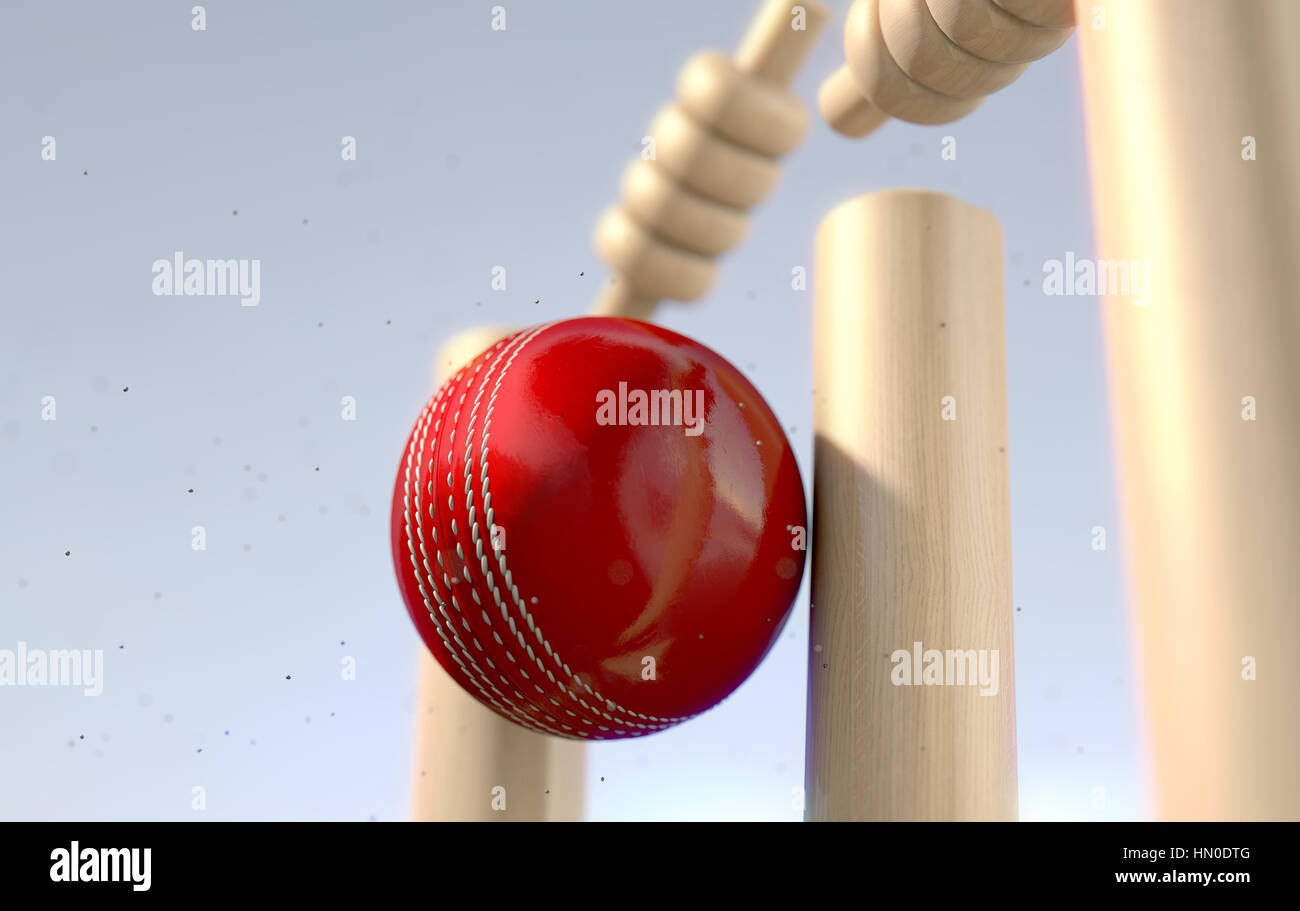A close up of a red leather stitched cricket ball hitting wooden wickets with dirt particles emanating from the impact in the daytime - 3D render Stock Photo