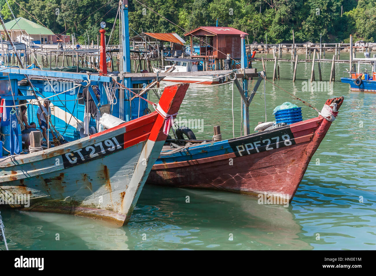 Traditional malaysian fishing boats at the Pulau Penang wharf Stock