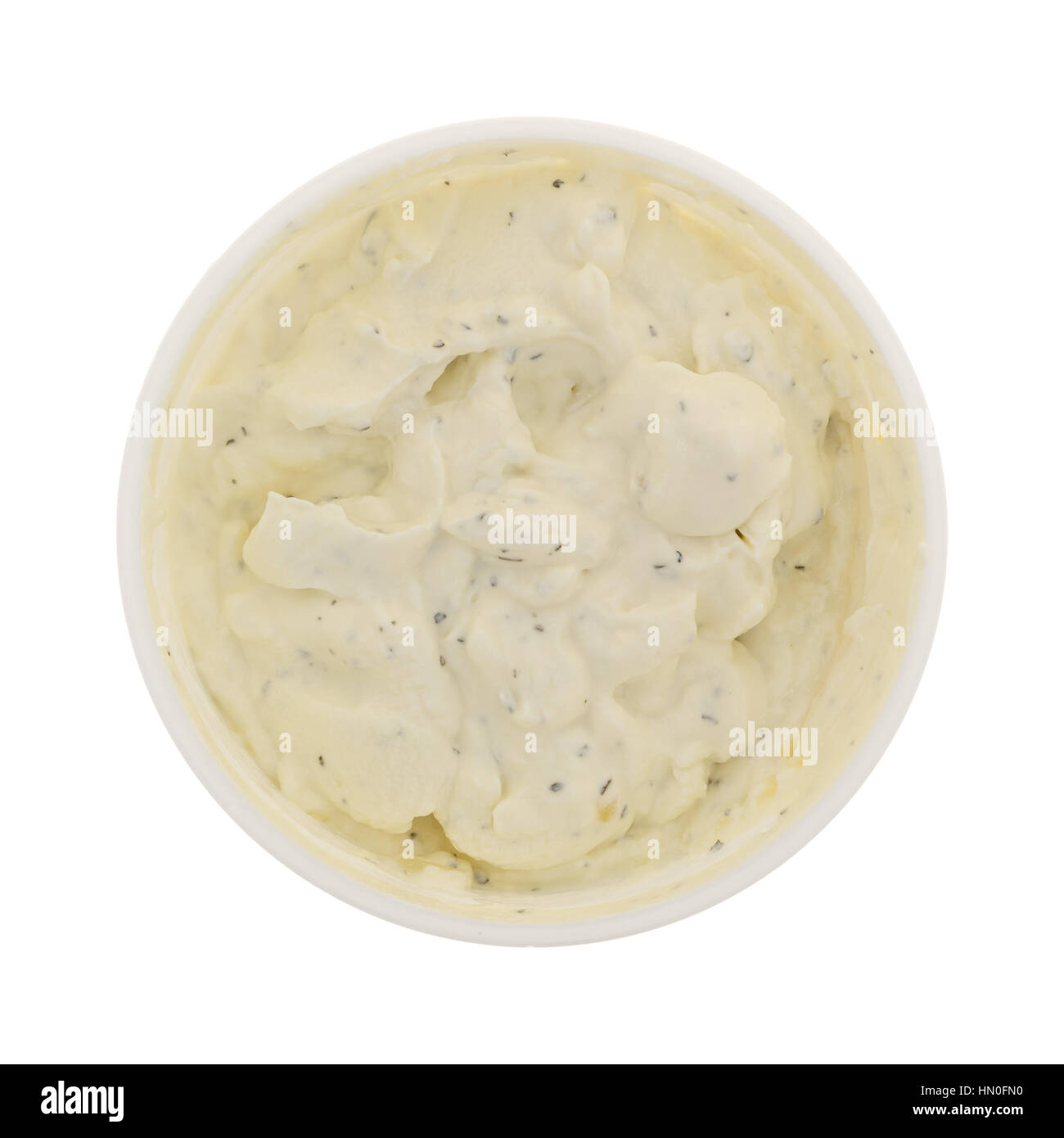 Top view of an opened container of fresh French onion dip isolated on a white background. Stock Photo