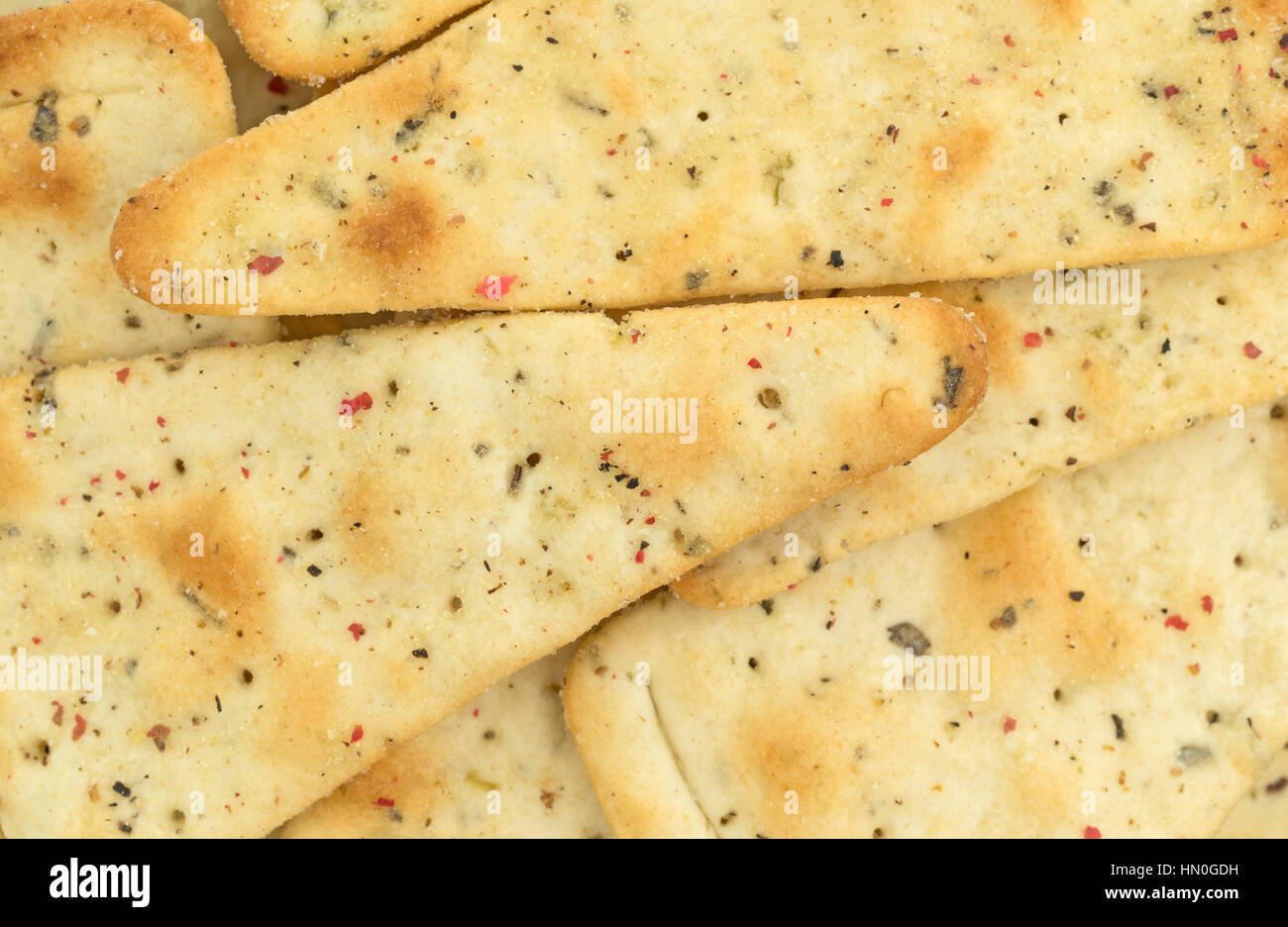 A very close view of seasoned pizza crust chips. Stock Photo