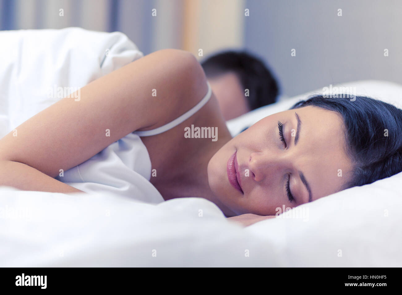 happy couple sleeping in bed Stock Photo - Alamy