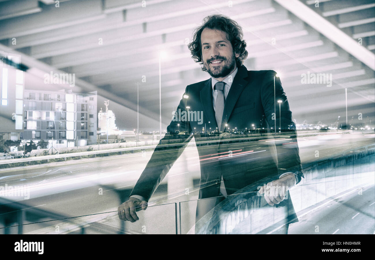 Portrait of happy businessman standing in office Stock Photo - Alamy