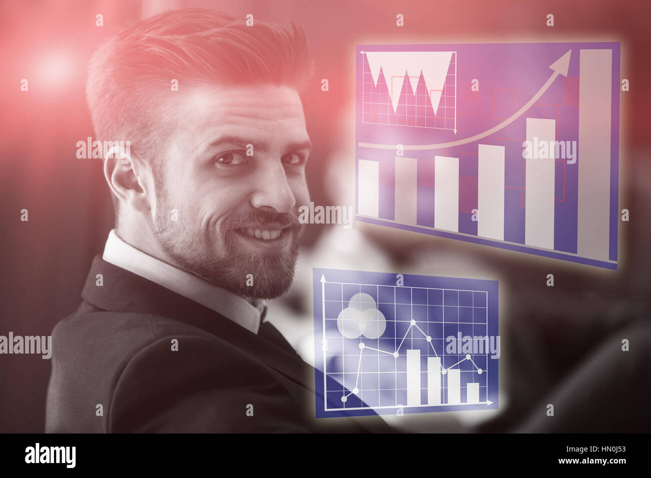 Graph against handsome businessman smiling Stock Photo - Alamy