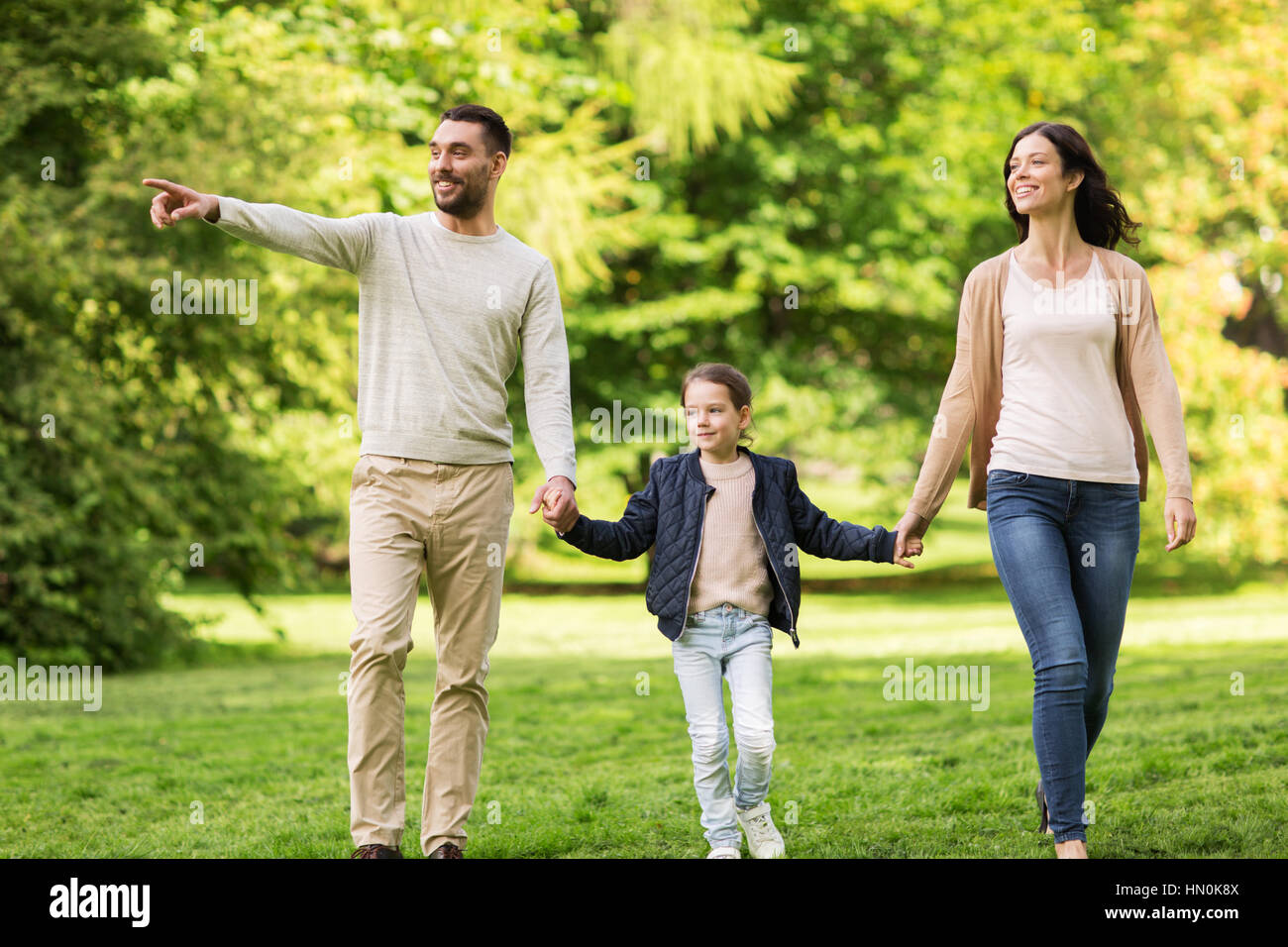 happy family walking in summer park Stock Photo - Alamy
