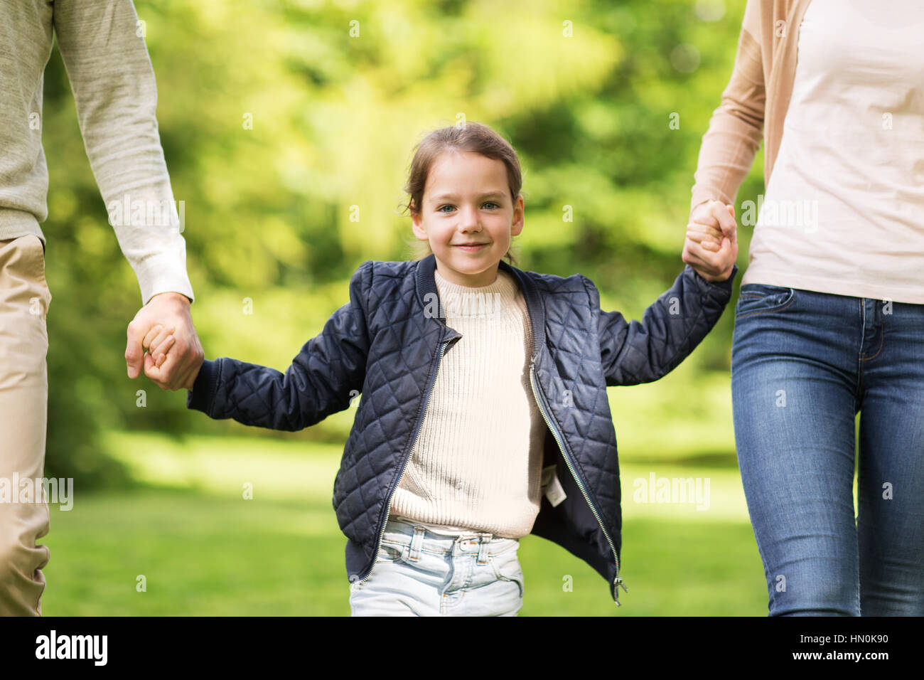 happy family walking in summer park Stock Photo - Alamy