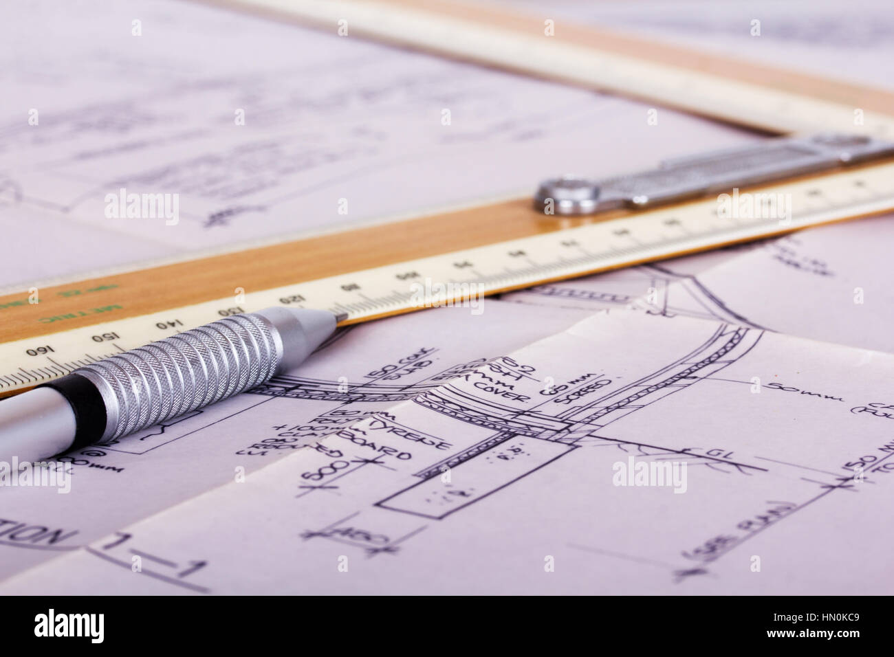Drawing equipment on detailed architects house plans Stock Photo Alamy