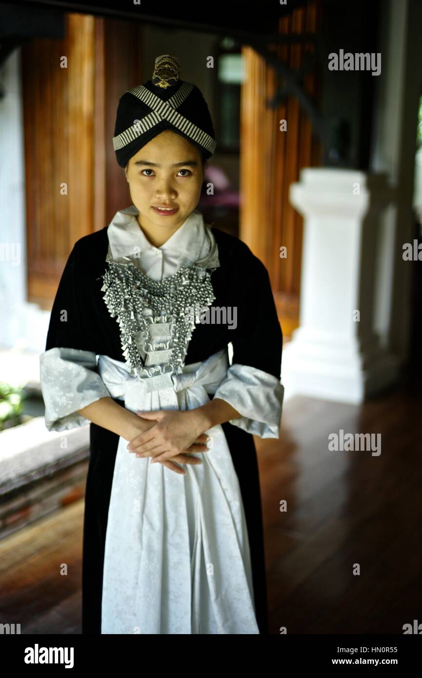 Young girl wearing a Hmong Kao traditional dress in Laos. Name: Anna Saksena Stock Photo