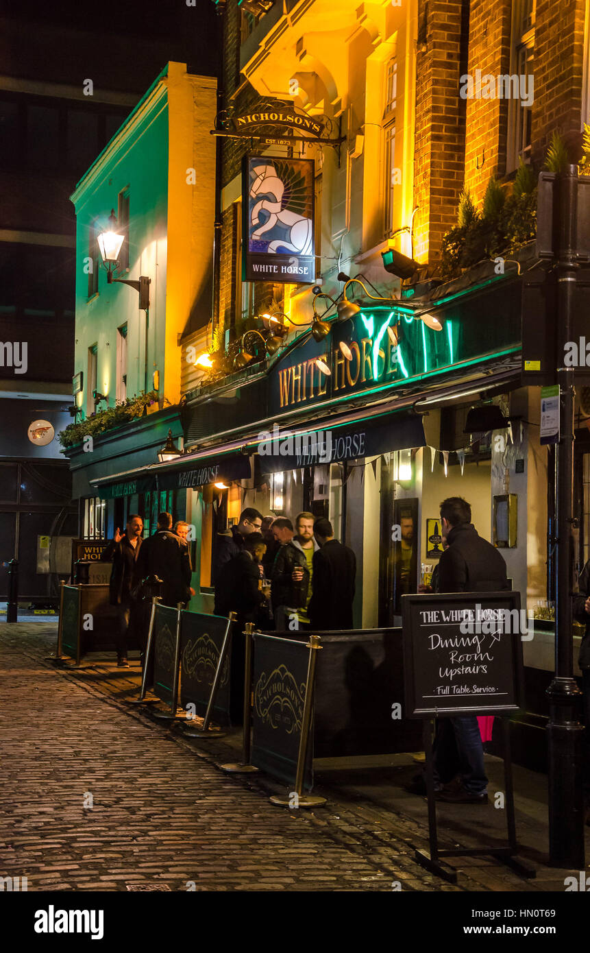 The White Horse pub on Newburgh Street in London at night. Stock Photo