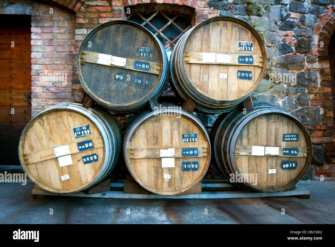 Five vintage wooden wine storage barrels stacked Stock Photo Alamy