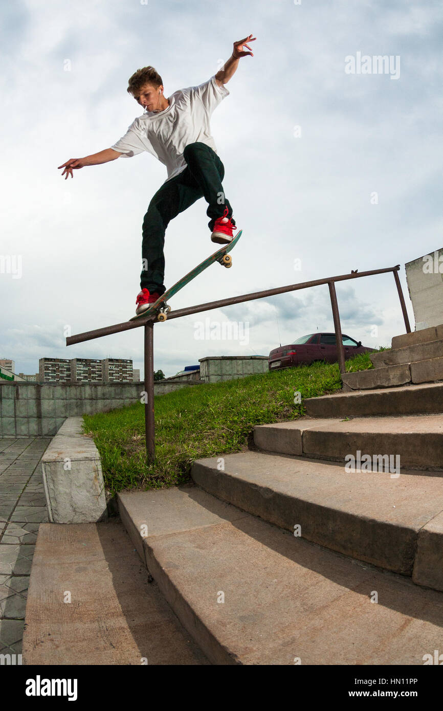 Zelenograd, Russia - July 29, 2009: Skateboarder Nikita Shumkov doing a