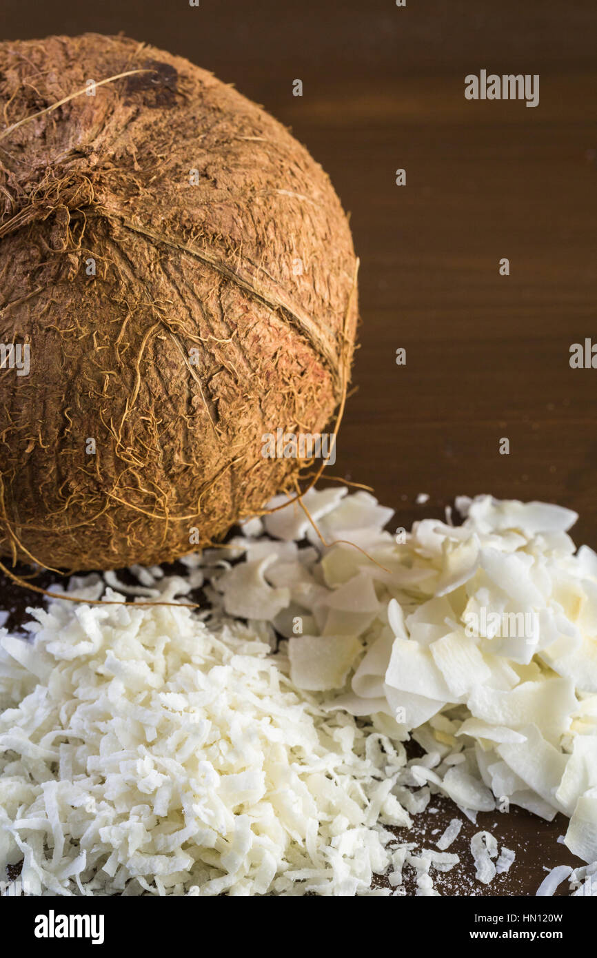 Dehydrated coconut flakes on a wood background Stock Photo Alamy