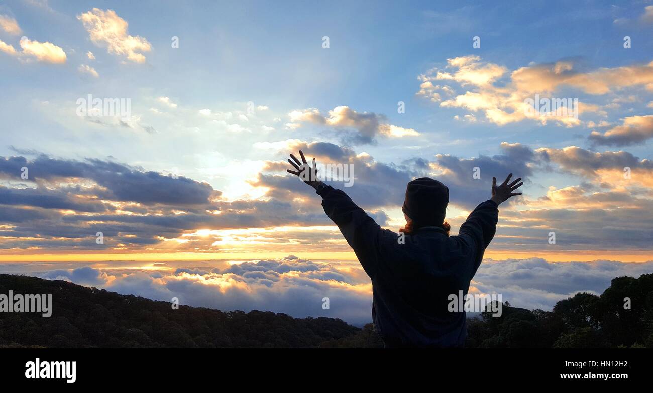 Woman silhouette arms up hi-res stock photography and images - Alamy