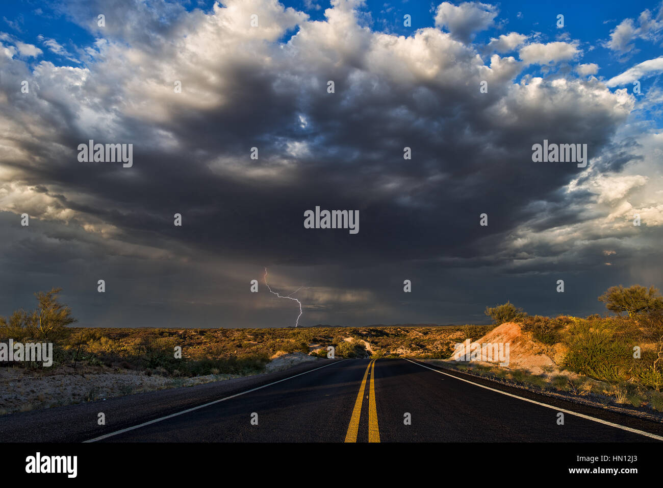 Road leading to stormy sky Stock Photo - Alamy
