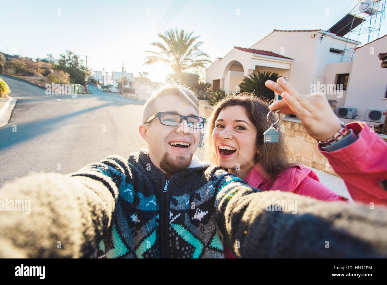 Happy smiling young couple showing a keys of their new house Stock ...