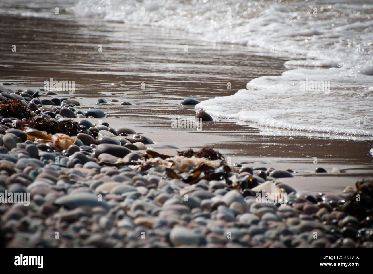 Sunny sand beach rolling waves hi-res stock photography and images - Alamy