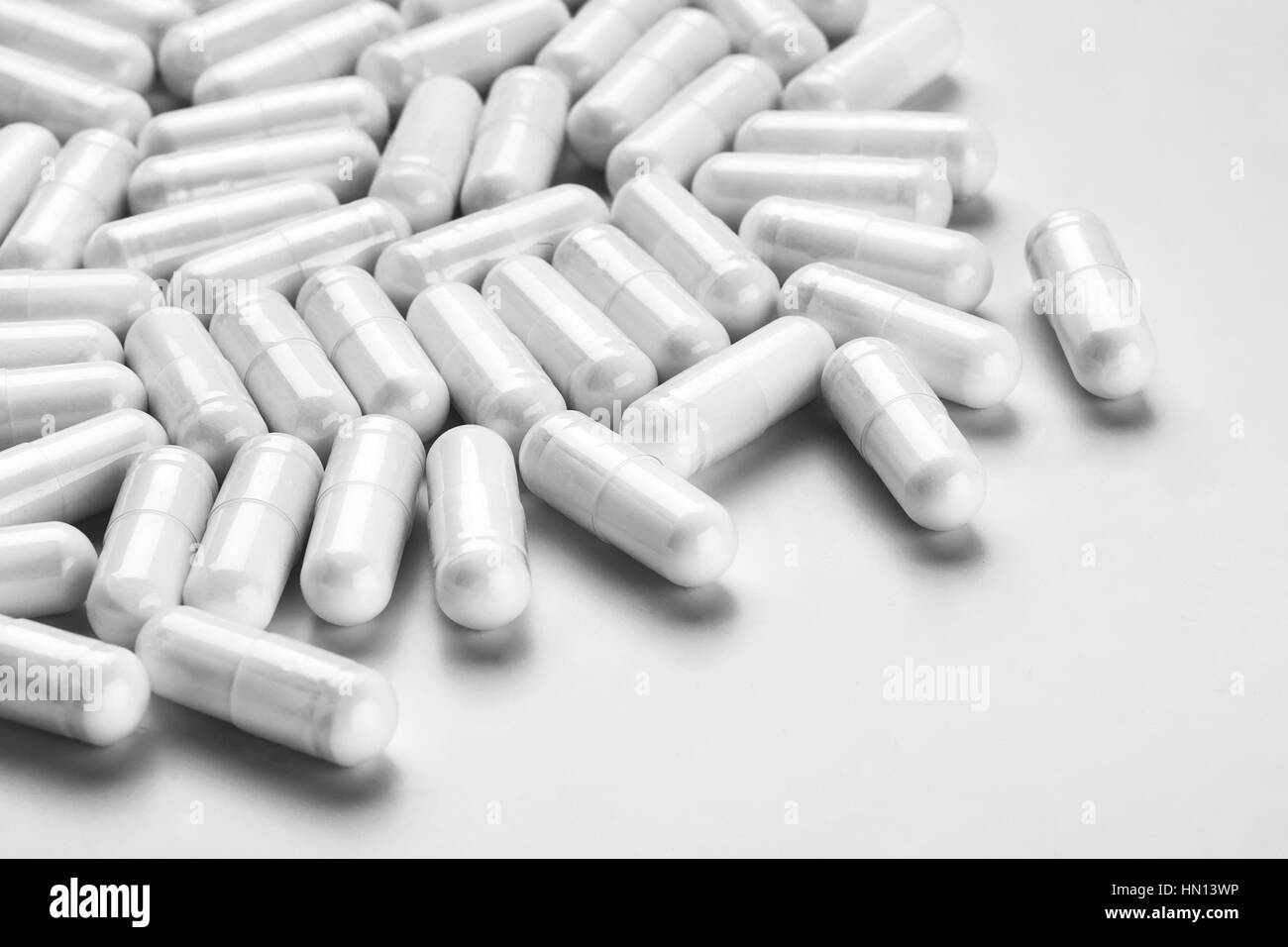 Many medicine capsules on gray background. High resolution product. Health care concept Stock Photo