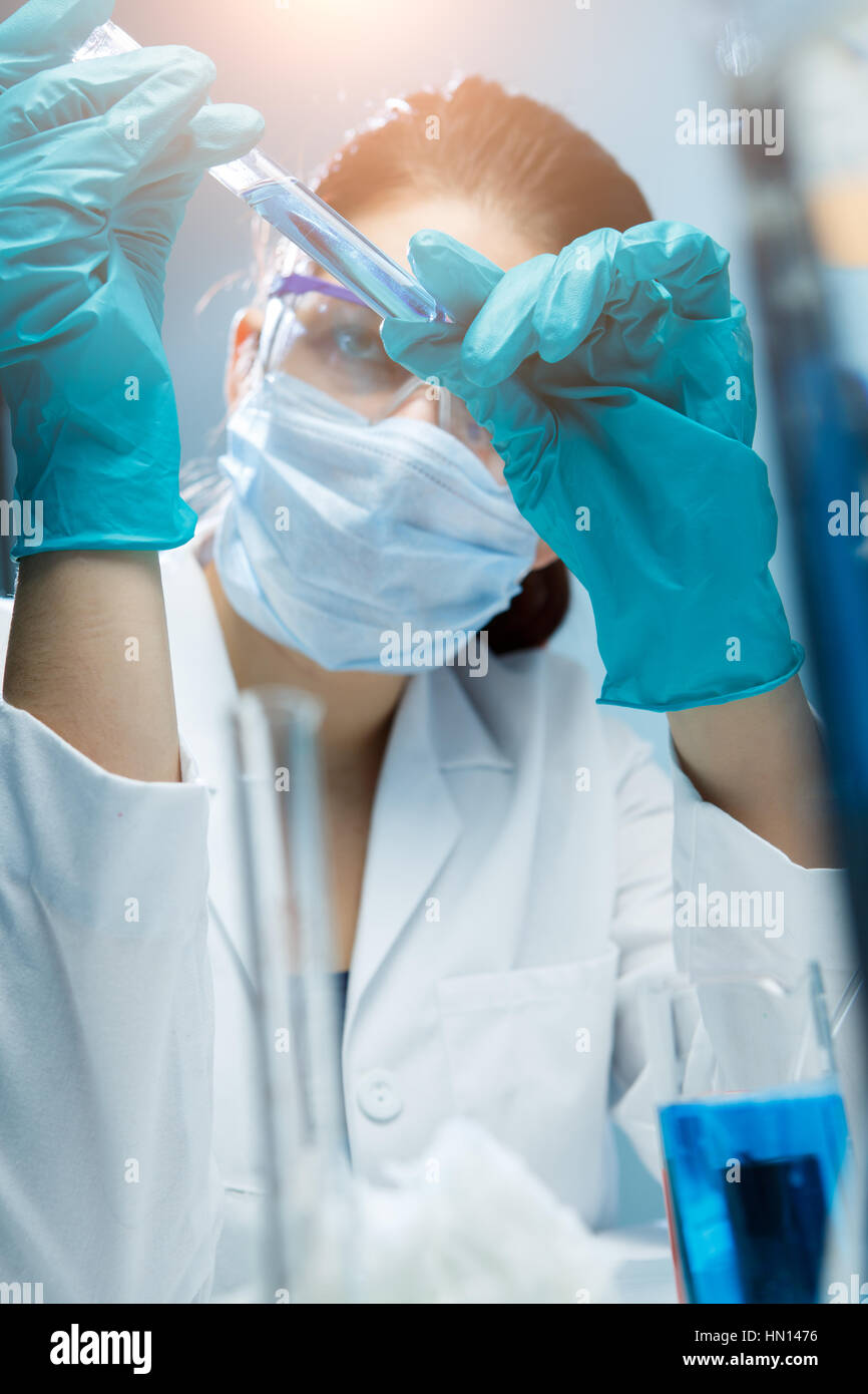 Lab assistant with reagents and test tubes in chemical laboratory Stock ...