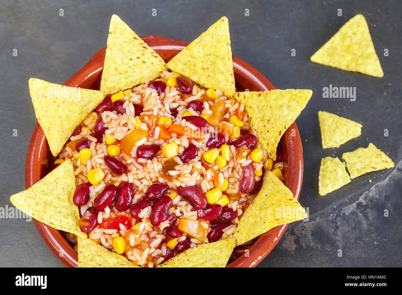 Chili con carne in a bowl with tortilla chips, top view. Stock Photo