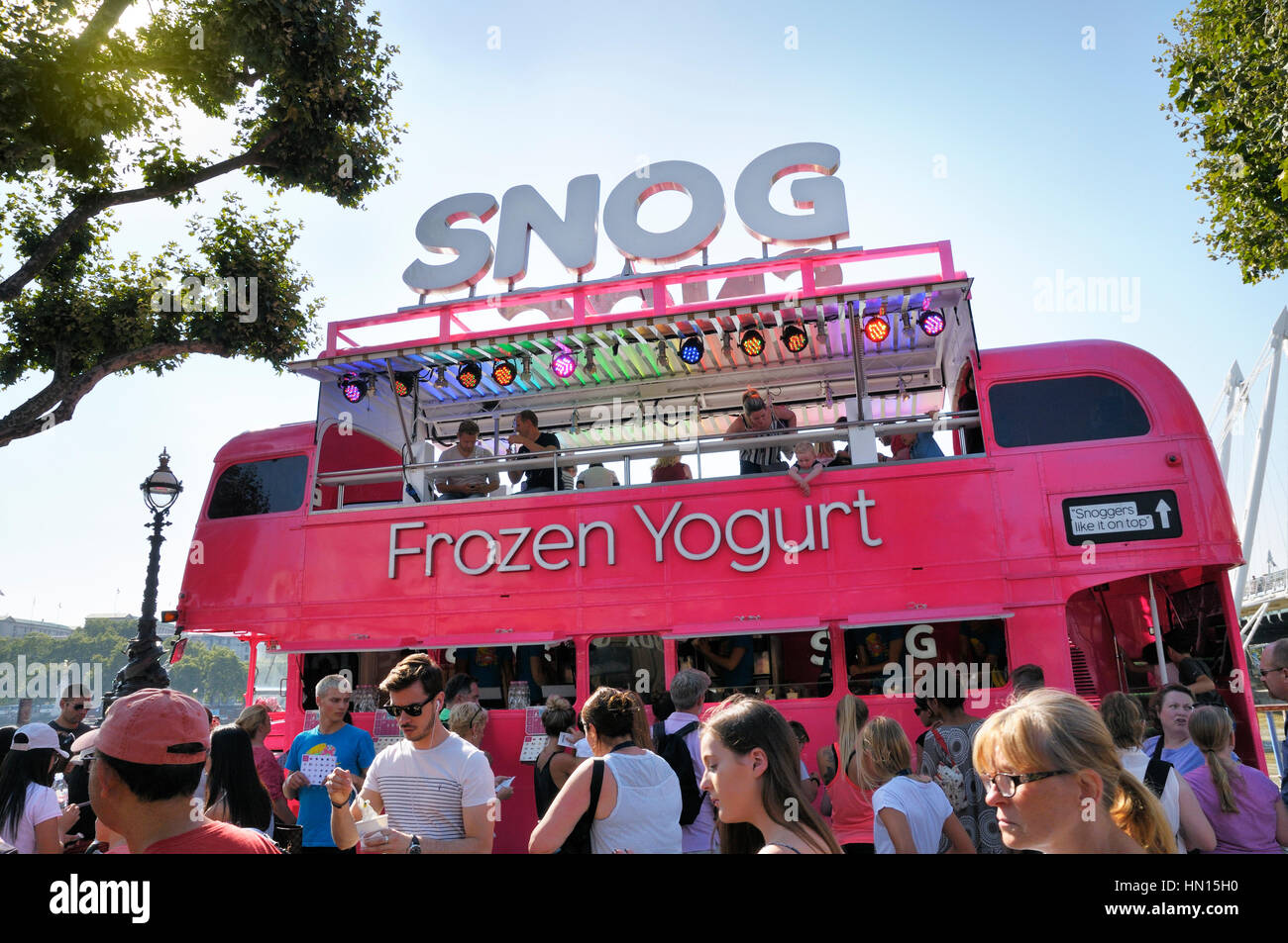 Snog Frozen Yogurt pink Routemaster bus drawing the customers on a beautiful summer's day on London's South Bank Stock Photo