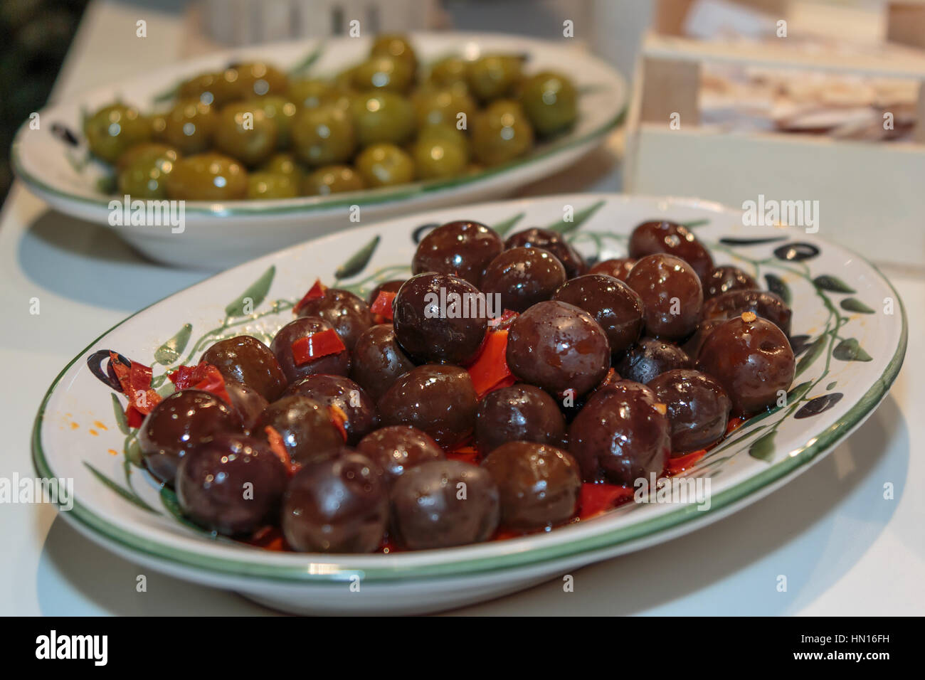 Brown and Green Olives inside White Decorated Pottery Stock Photo Alamy