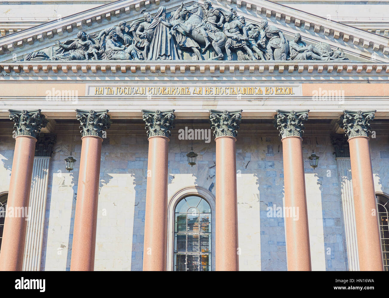 Sculpture and red granite columns on facade of St Isaac's Cathedral, St Petersburg, Russia Stock Photo