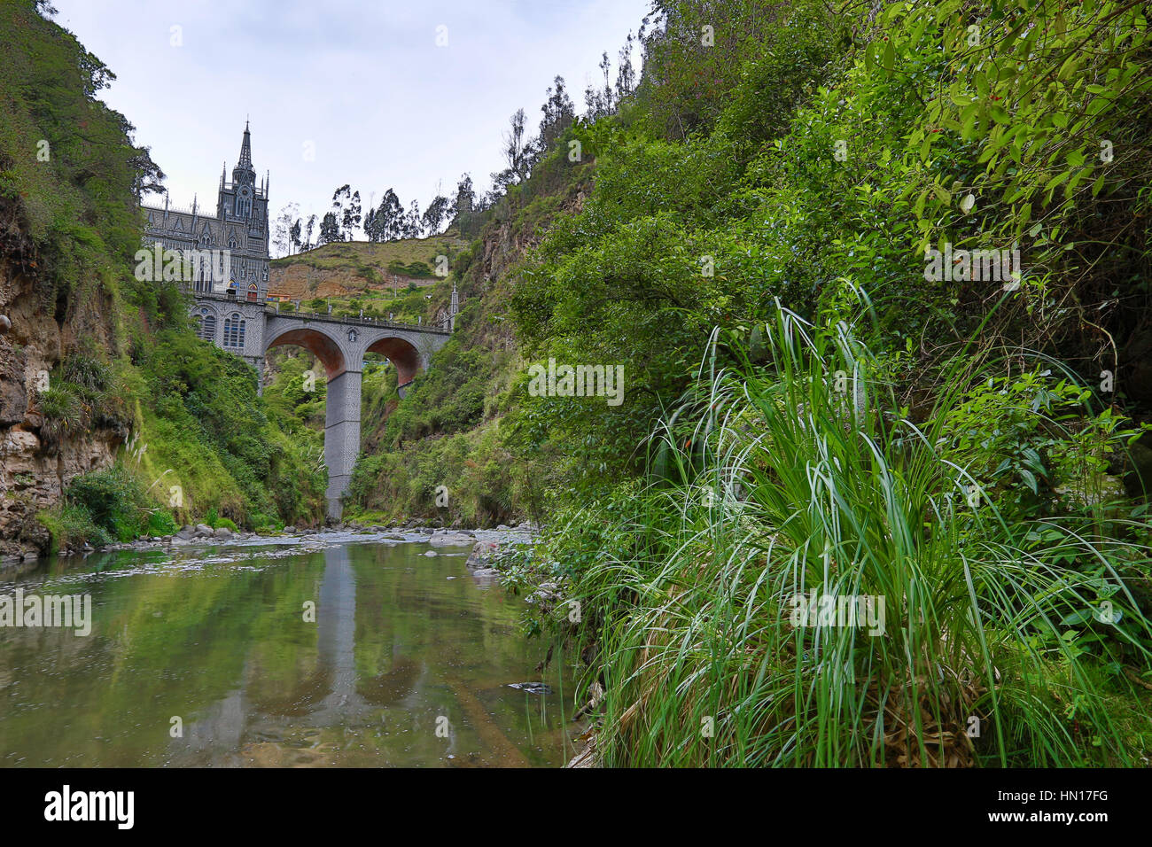 the Las Lajas sanctuary seen from the river in the valley beneath Stock Photo