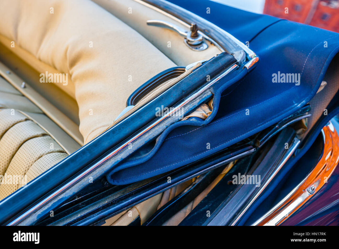 Color and beauty of vintage cars. Convertible top of an old luxury automobile. Leather seats. Vibrant colors. Stock Photo
