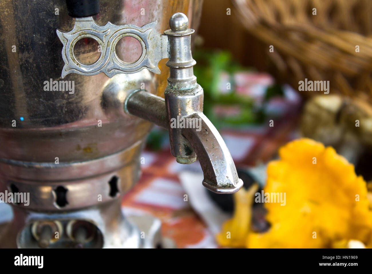 Samovar on a table.Samovar crane.Chayapitiye, taste, nostalgia on old. Stock Photo