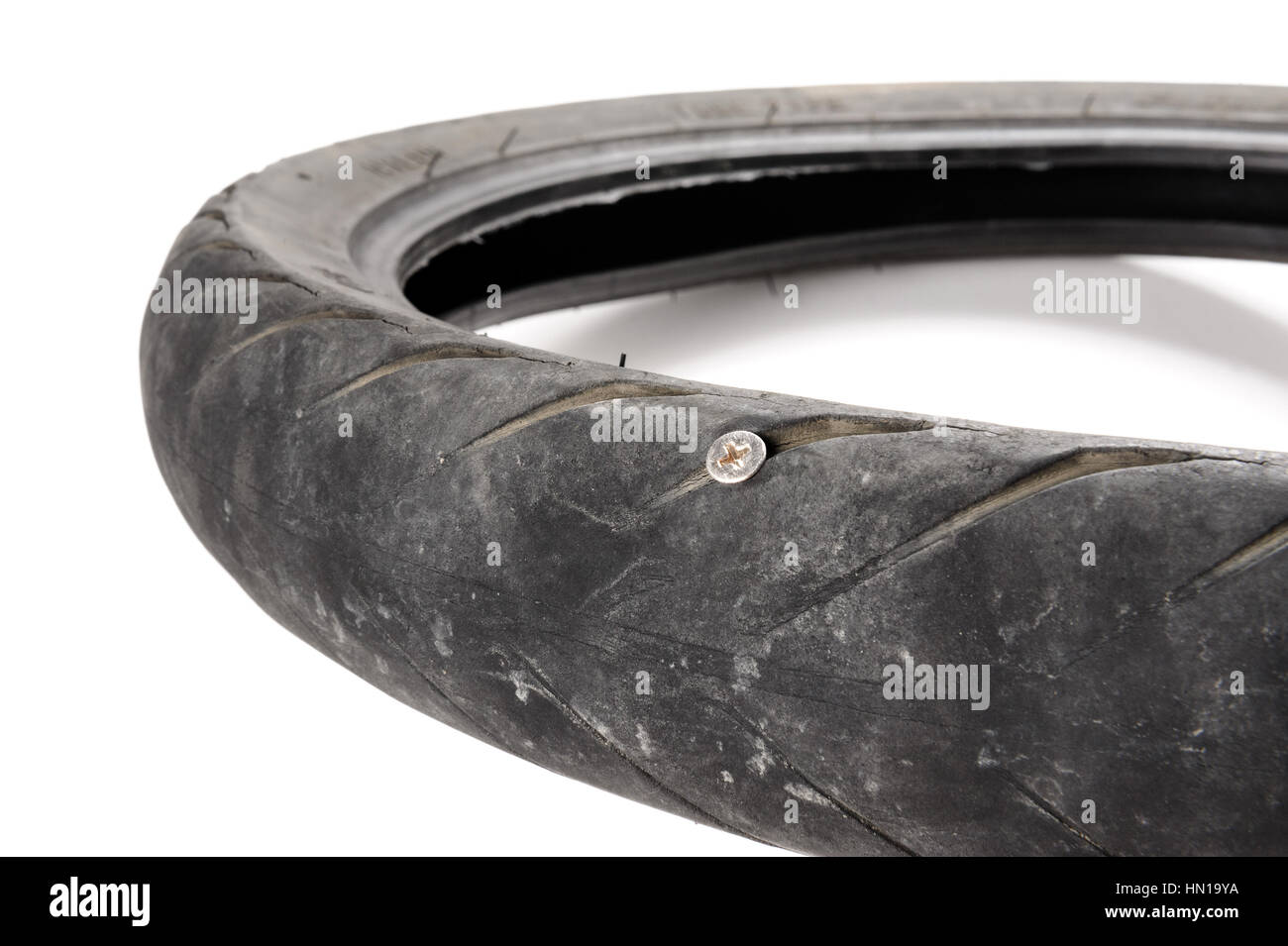 screw nail puncturing motorcycle tire Stock Photo Alamy
