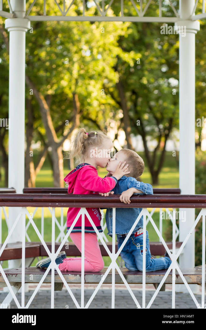 Love concept. Couple of kids loving each other hugging and kissing