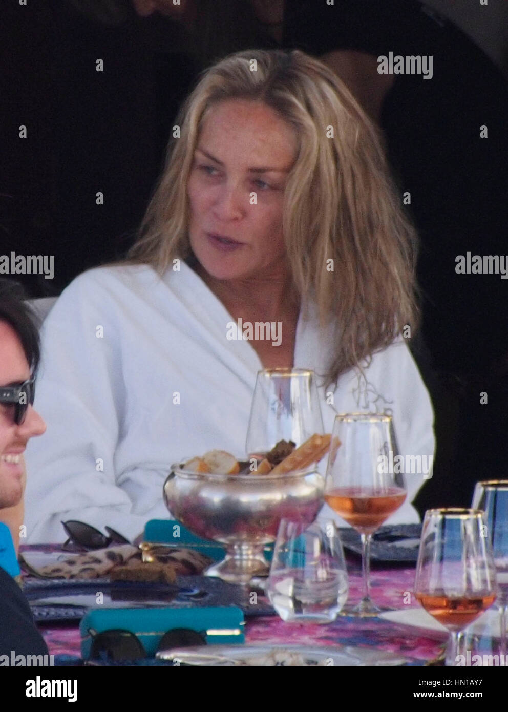 Sharon Stone eats lunch in her bathrobe and no make-up on the Roberto Cavalli yacht in the harbor at the 66th Cannes Film Festival in Cannes, France on May 21, 2013. Photo by Francis Specker Stock Photo