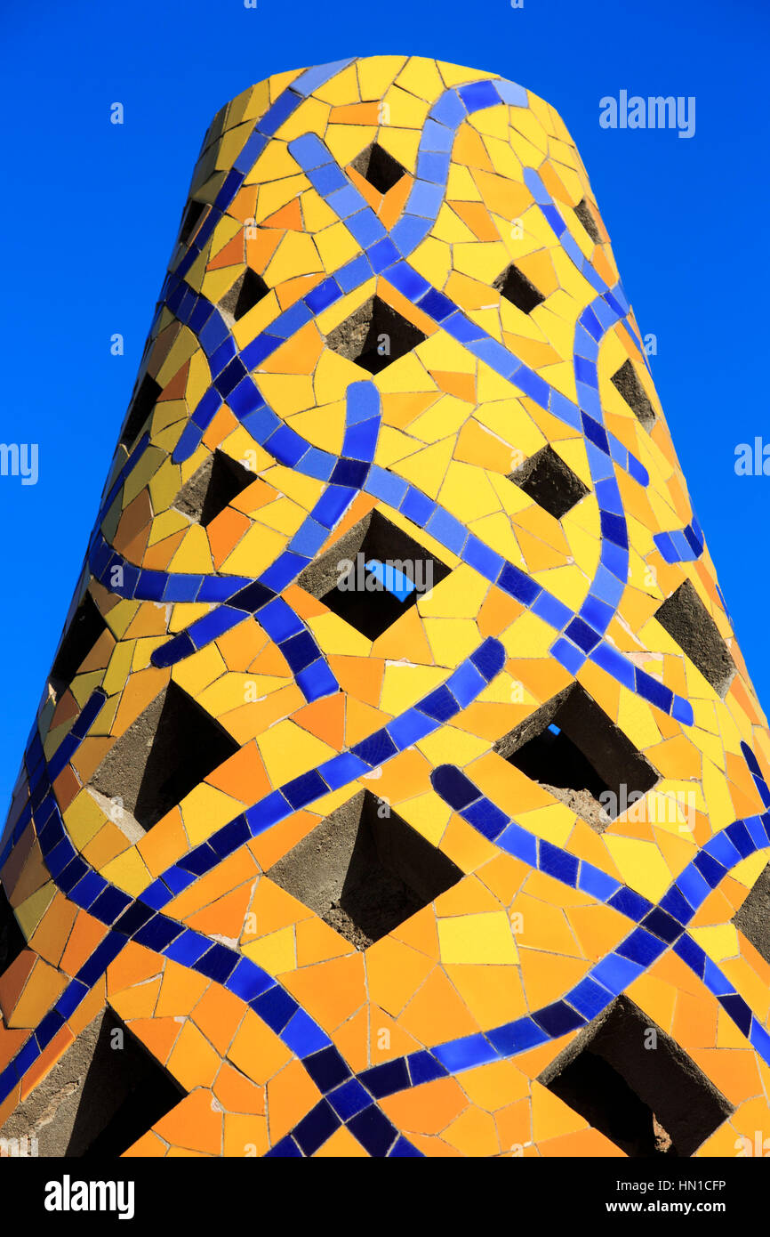 Colourful chimney pods or ventilation shafts on the roof of Palau Guell, designed by Antoni Gaudi, Barcelona, Catalonia, Spain Stock Photo