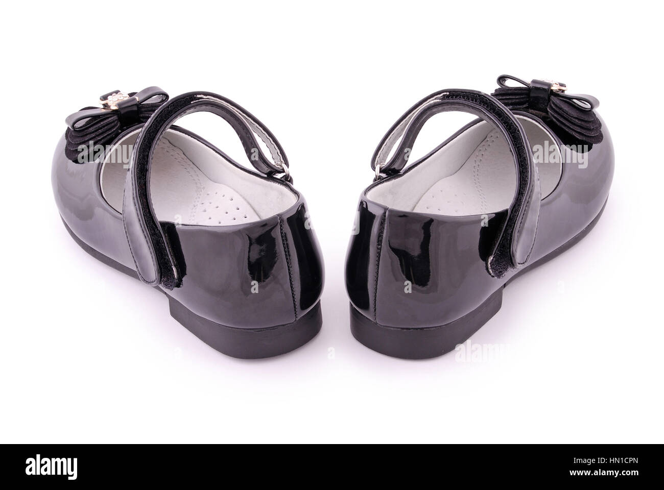 Pair of children's black patent leather shoes. Clipping path included. Stock Photo