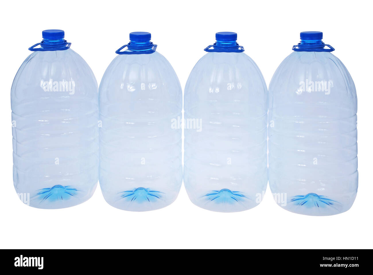 Four big bottles of water isolated on a white. Clipping path included. Stock Photo