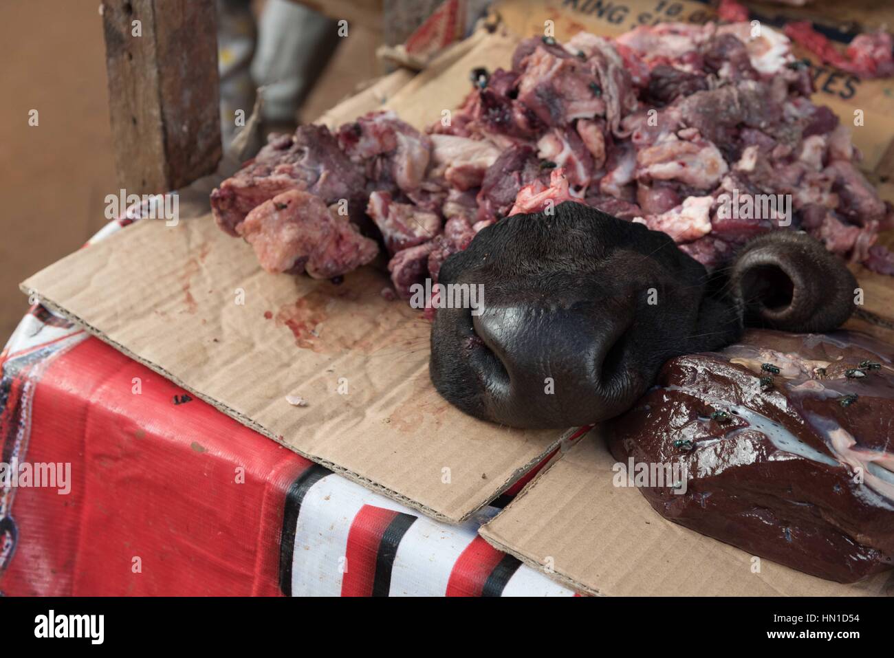 A snout and meaty scraps for sale at a Cambodian meat market.  Still life. Stock Photo