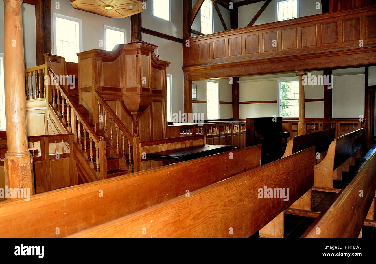 West Barnstable, Massachusetts - July 13, 2015:  Minister's lectern and wooden pews inside the historic 1717 West Barnstable Parish Meeting House Stock Photo